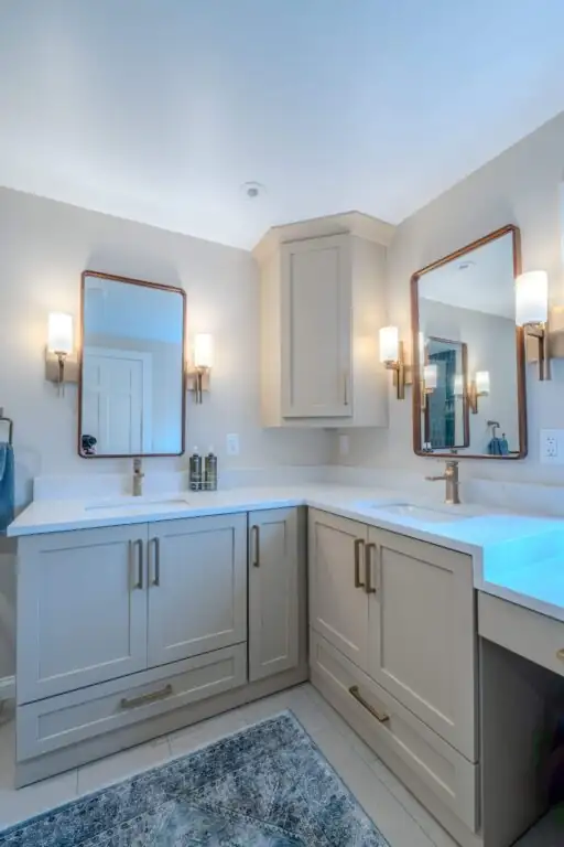 Broadview Heights, OH bathroom remodel with sage green vanity, makeup counter and brass sconces